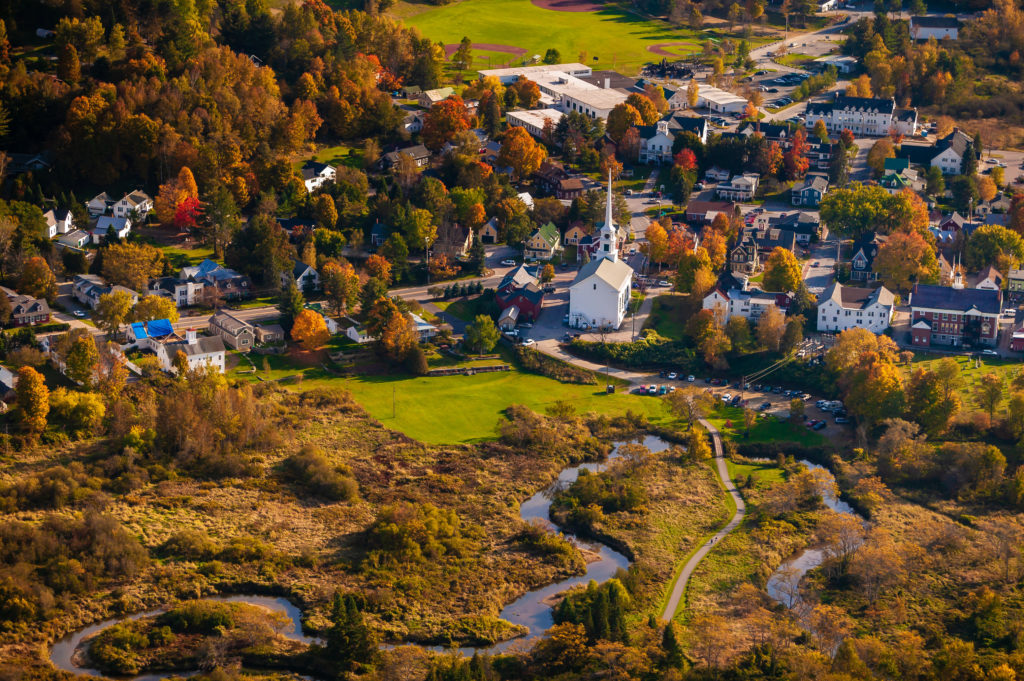 Aerial view of the town of Stowe Vermont on a colorful autumn afternoon | Travel Destinations in the U.S.