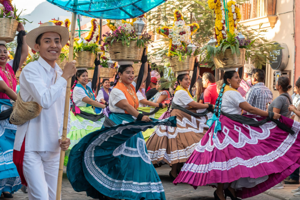 Oaxaca, Oaxaca, Mexico- July 6, 2019: People dressed with traditional clothes during the Convite | Best cheap activities in Mexico on vacation