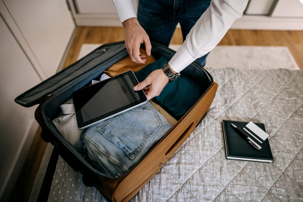 Business men packing for business trip, business travel