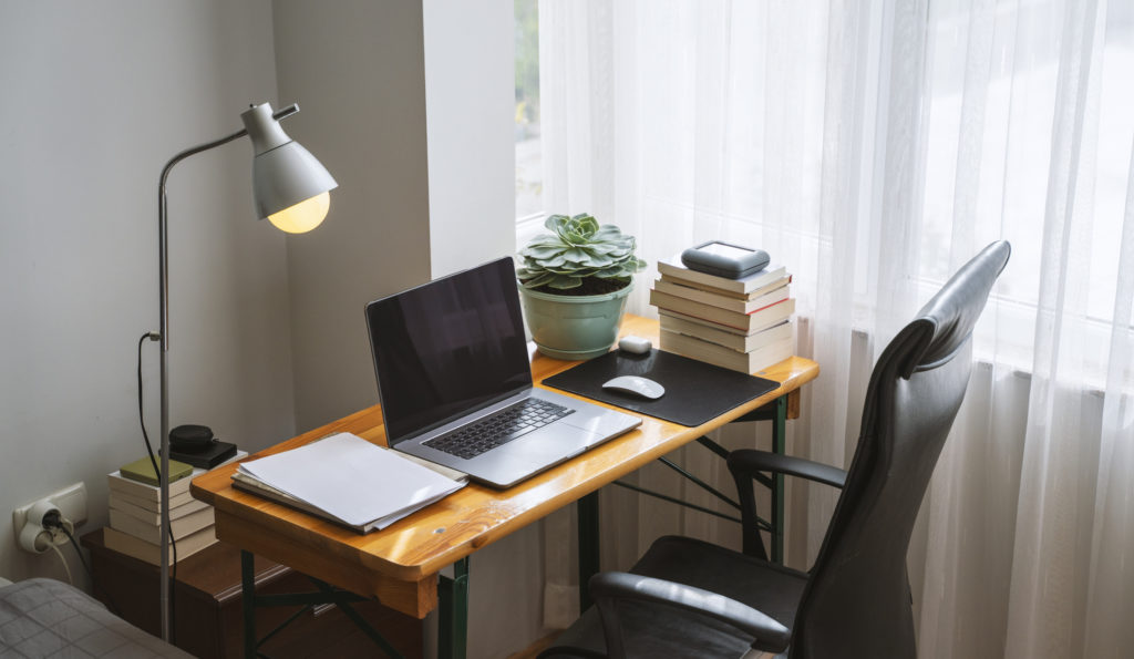 Simple home office setup with a table and laptop, work from home setup